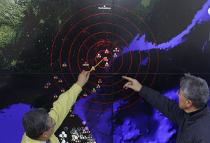 Officials examining a map that showed seismic waves from North Korea